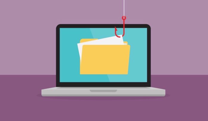 Hacker uses a red fishing hook is stealing a file from laptop