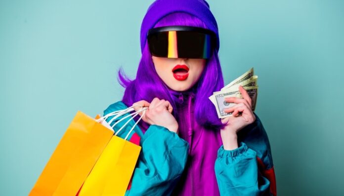 Stylish girl in cyber punk glasses and 80s tracksuit hold money and shopping bags on blue background